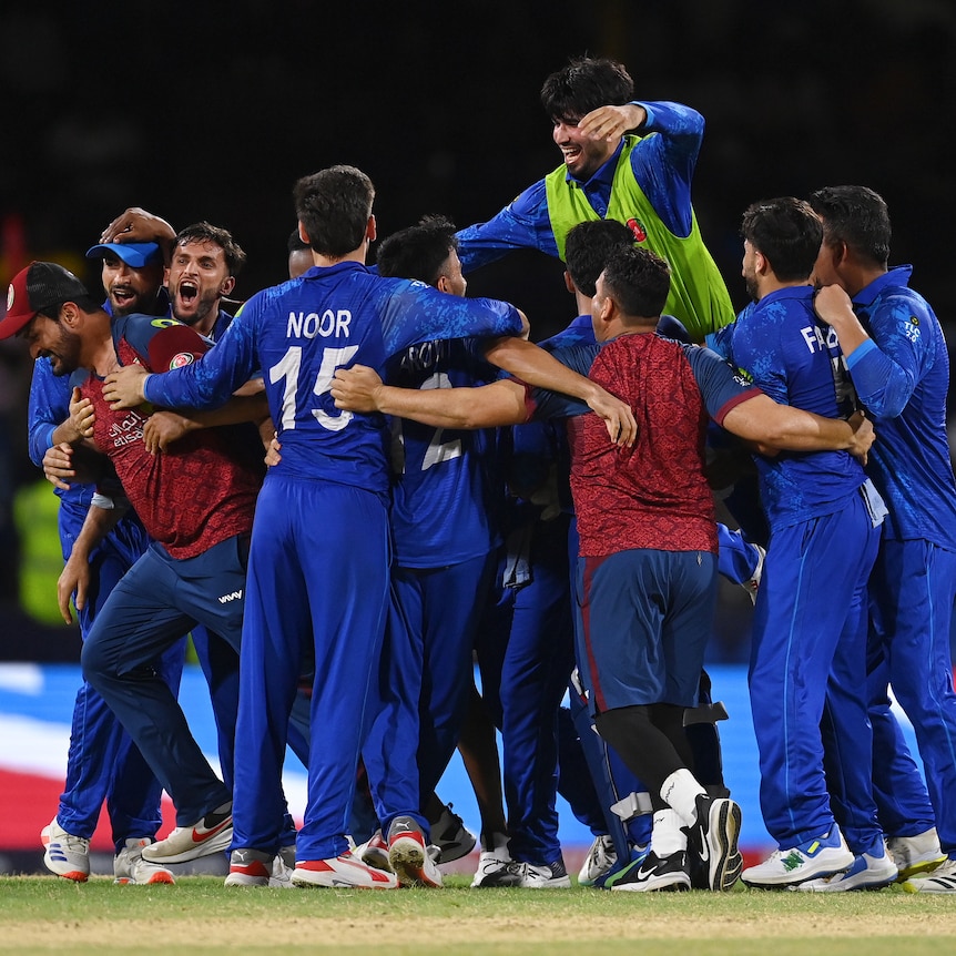 Afghanistan celebrates defeating Australia at the men's T20 World Cup.