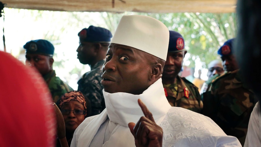  Yahya Jammeh shows his inked finger before voting in Banjul, The Gambia.