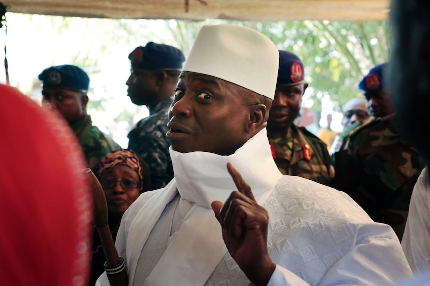 Gambia's president Yahya Jammeh shows his inked finger before voting in Banjul, Gambia