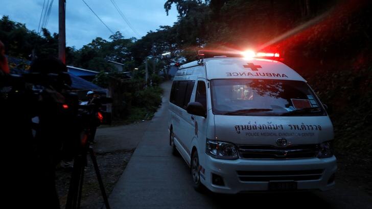 Ambulance leaves Tham Luang cave with red light on