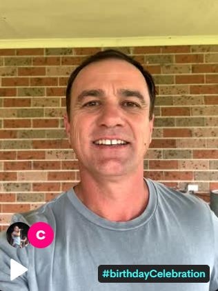 Shannon Noll in a t-shirt looks at the camera