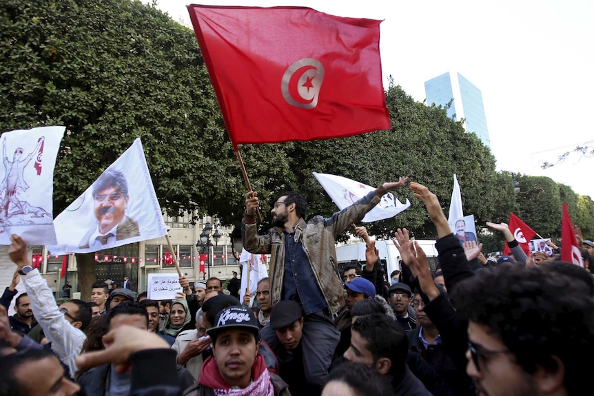 Unemployed graduates shout slogans during a demonstration.