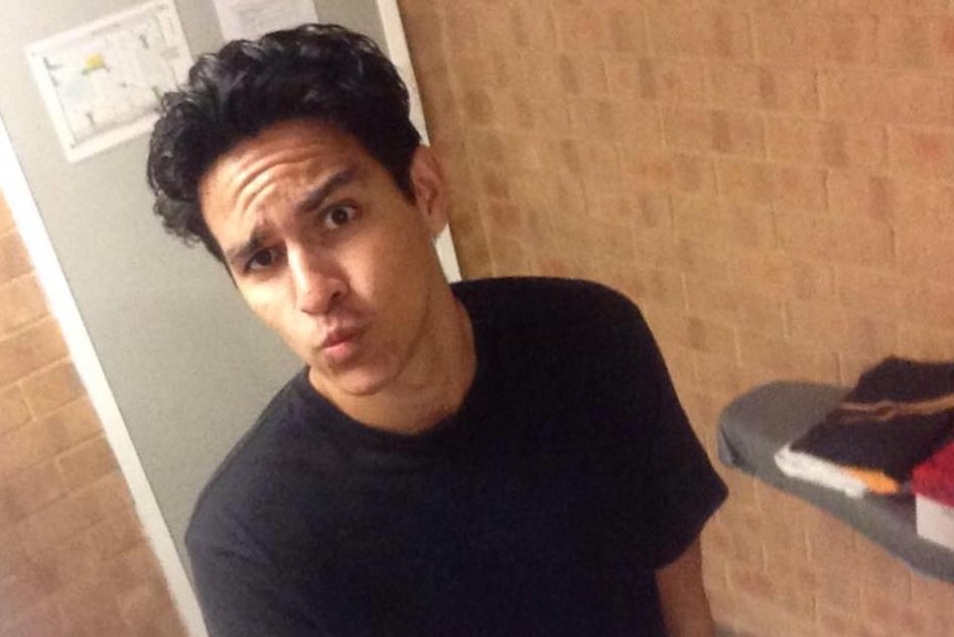 Shai Anthony Martin wears a black shirt and takes a selfie