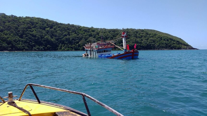 Partly sunk suspected illegal fishing boat in waters off Cape Kimberley in the Daintree.
