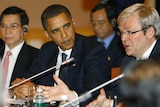 Obama watches on as Kevin Rudd speaks at APEC