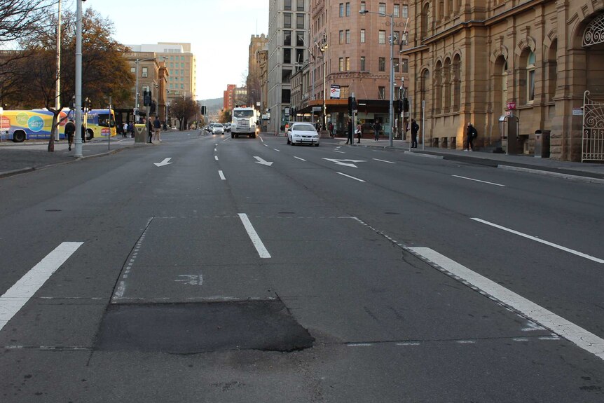 Macquarie Street marked for where hole for artist Mike Parr will be dug