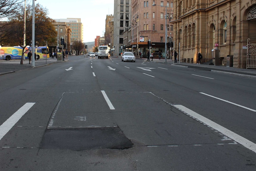 Macquarie Street marked for where hole for artist Mike Parr will be dug