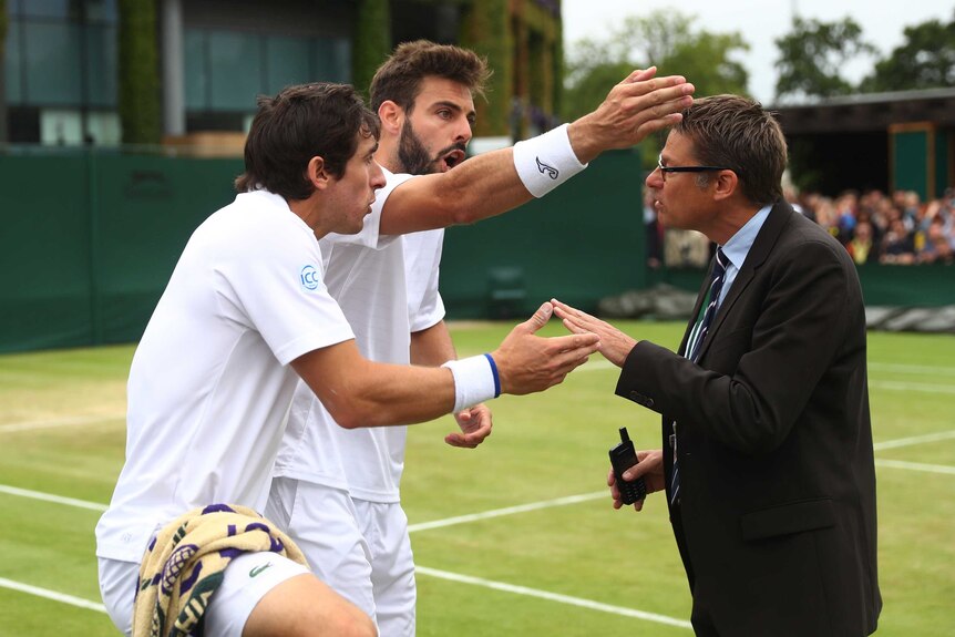 Marcel Granollers and Pablo Cuevas argue with the referee