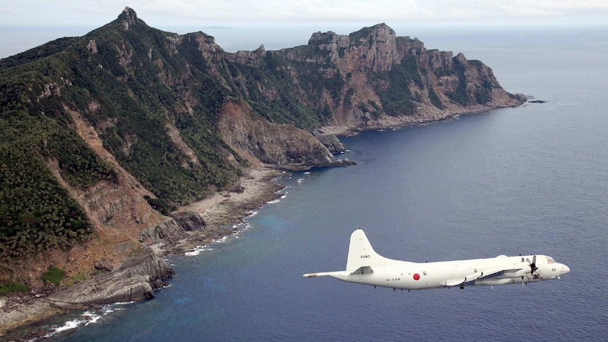 Japanese Maritime Self-Defence Force flies over disputed islands