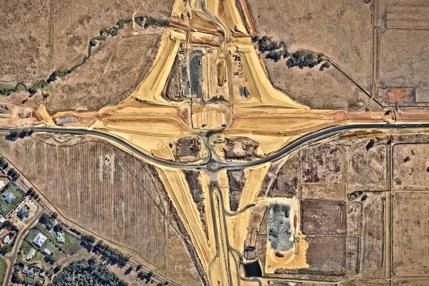 An aerial image of a rural freeway under construction