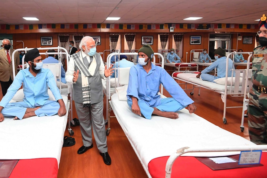 Indian Prime Minister Narendra Modi visits soldiers receiving treatment after being injured in clashes with Chinese soldiers