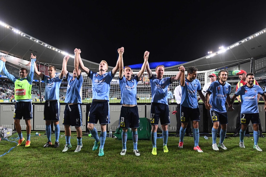 Sydney FC players celebrate their A-League semi-final win