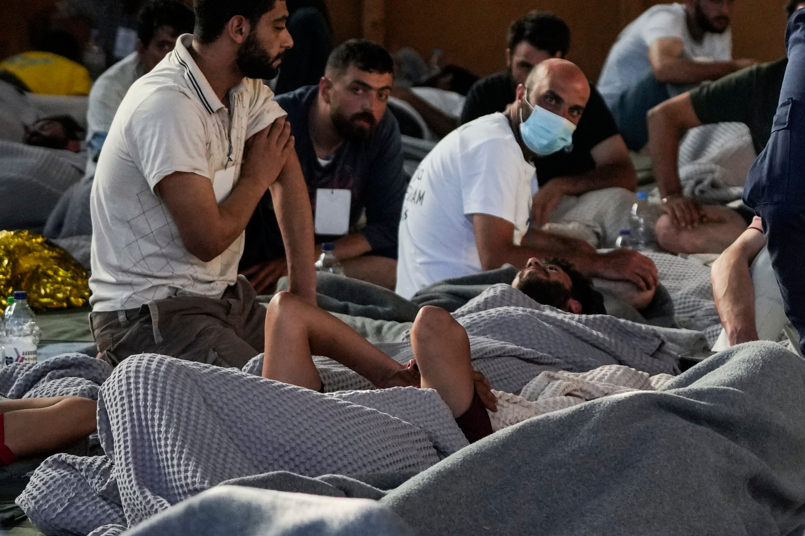 Greece boat survivors laying down 