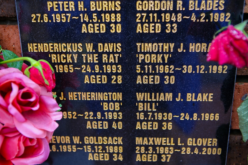 Close-up of names on the memorial wall.
