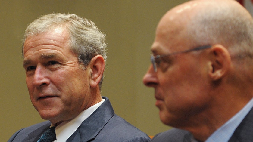 'The world's major economies can overcome the challenges we face' ... Bush with Paulson.
