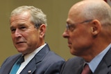 Tight shot of George W Bush and Henry Paulson at G7 meet