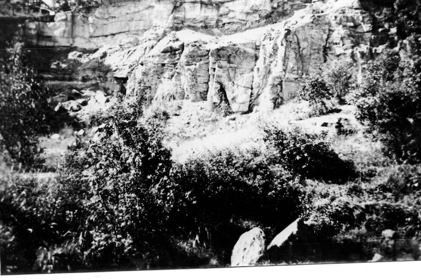 Black and white photo of cliffs of coal mine