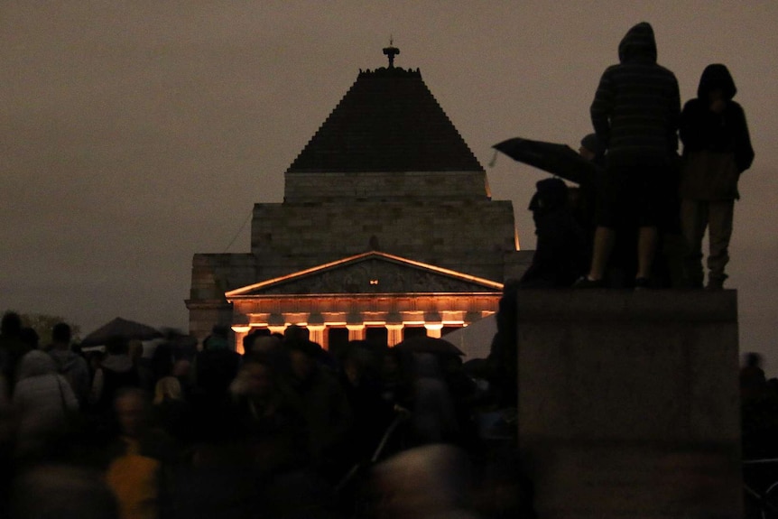 The crowd looks on at Melbourne's dawn service