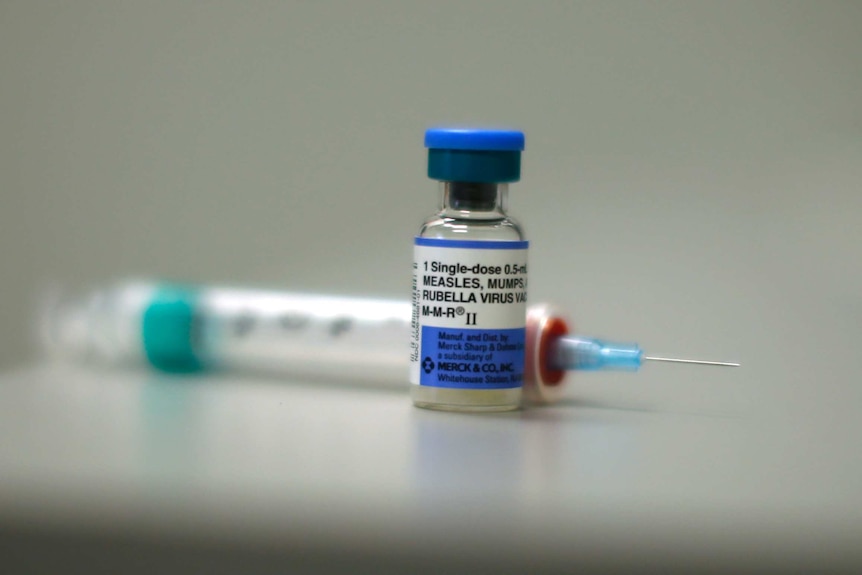 Small bottles containing measles vaccine.