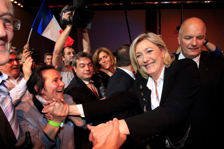 Marine Le Pen greets supporters in Paris