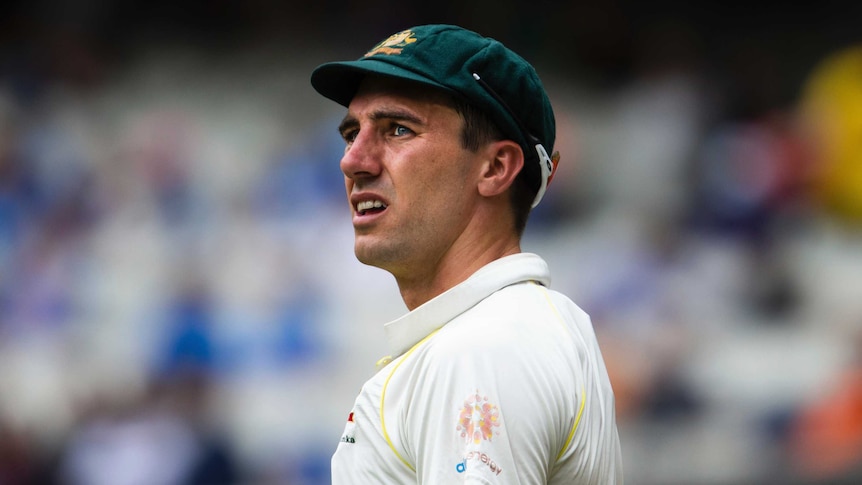 A close-up of Pat Cummins looking towards the horizon at the MCG