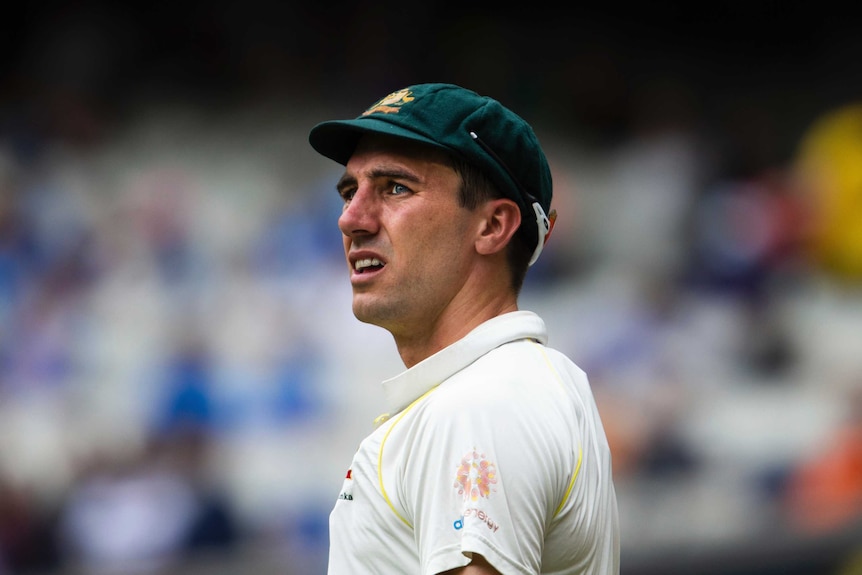 A close-up of Pat Cummins looking towards the horizon at the MCG