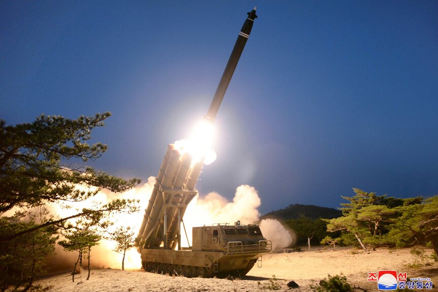 A missiles being launched at night time.