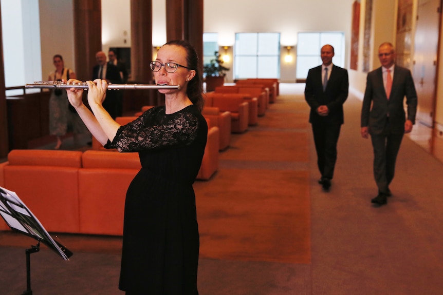 A flautist performs in Parliament House