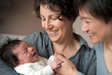 Penny Wong and Sophie Allouache hold their baby girl, Alexandra.