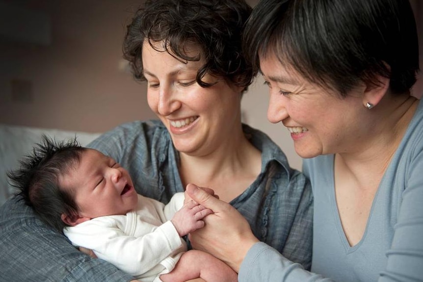 Penny Wong and Sophie Allouache hold their baby girl, Alexandra.