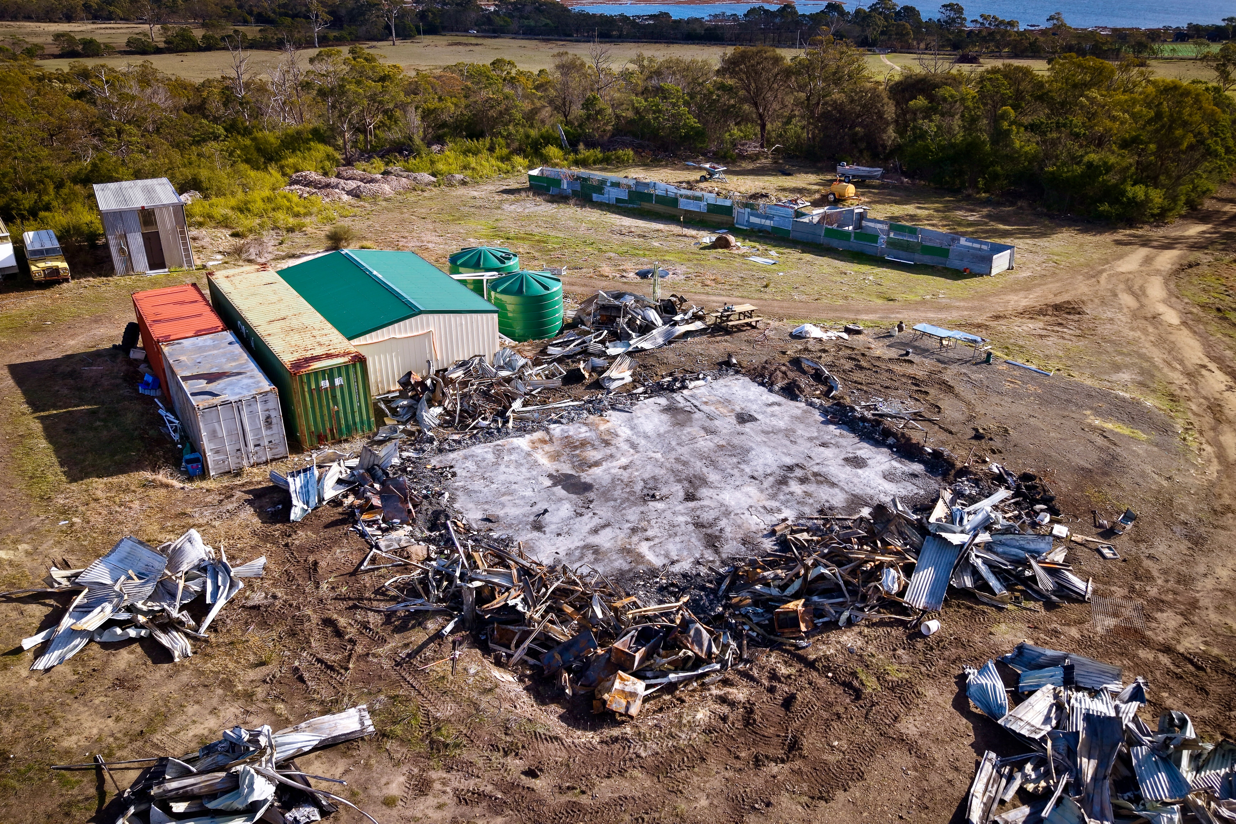Aerial view of a rural residence destroyed by fire.