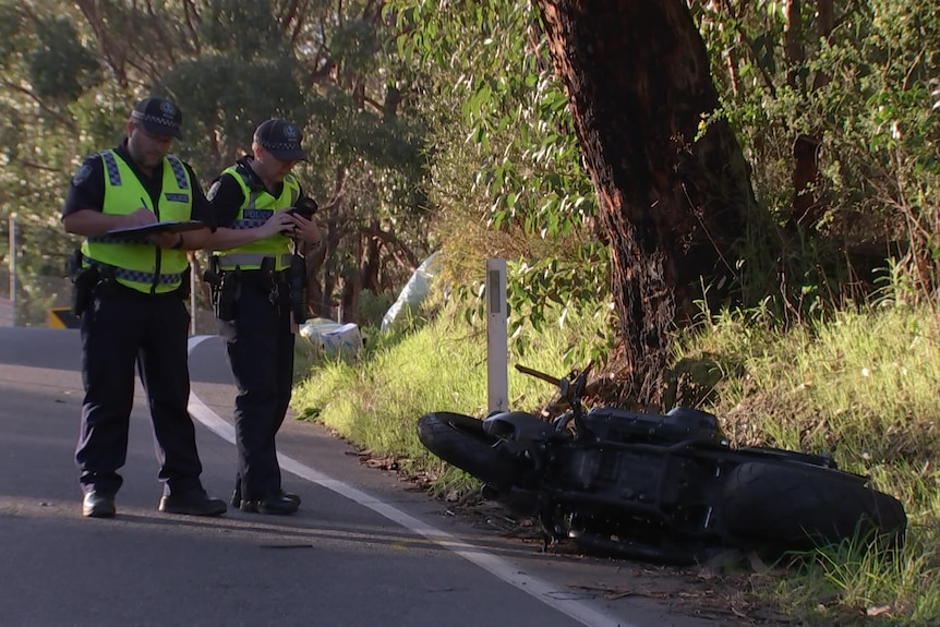 Police taking pictures at the scene of a fatal crash 