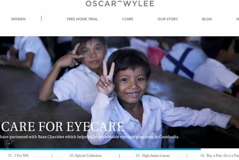 An advertisement showing school Cambodian school children smiling at the camera.