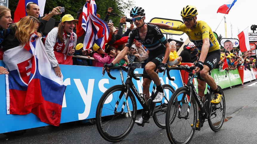 Chris Froome crosses the finish line alongside Wout Poels
