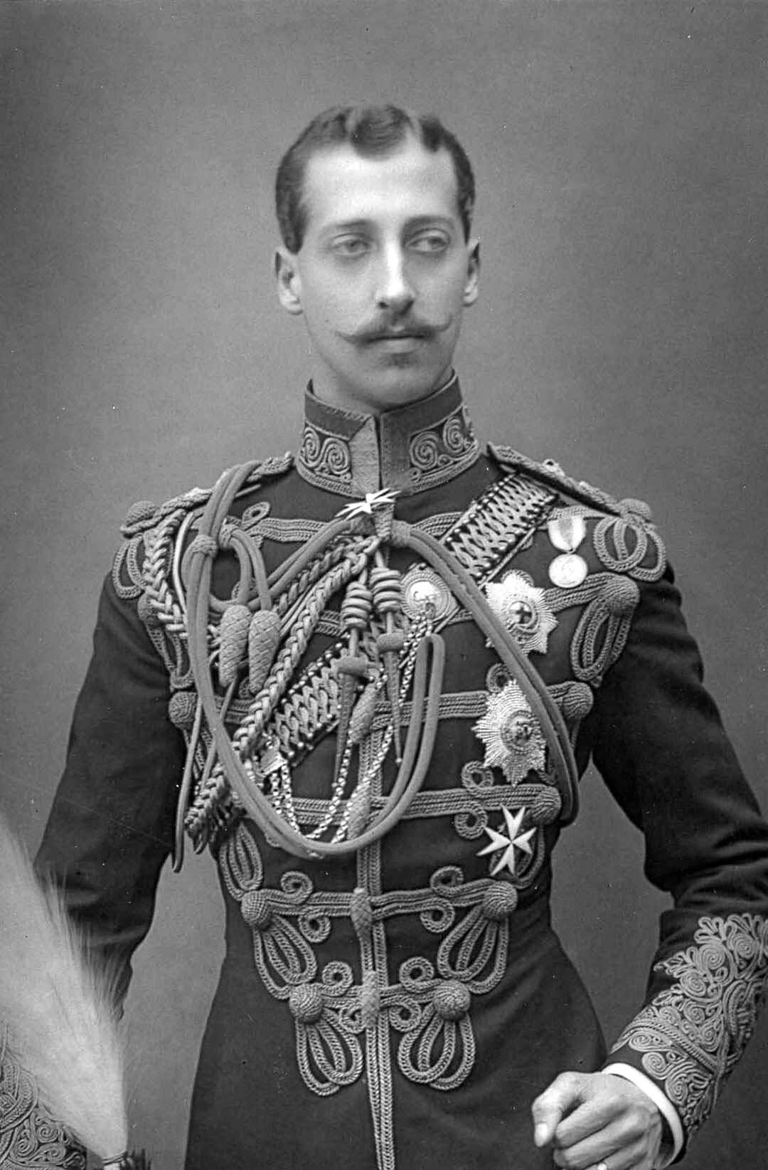 A black and white potrait of a man with a moustache wearing a formal military costume.