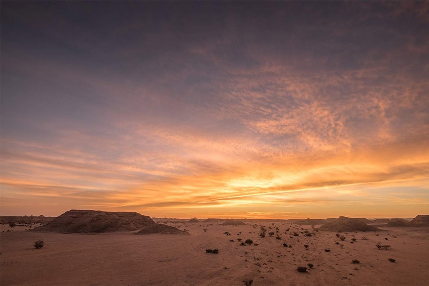The sun sets over the Omani desert