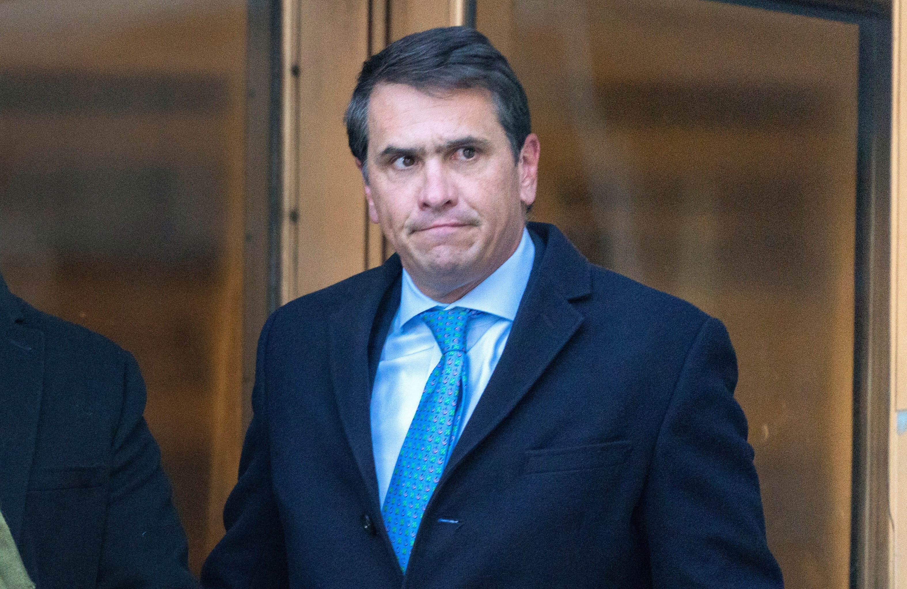 A close up of Todd Blanche wearing a suit and a serious expression on his face