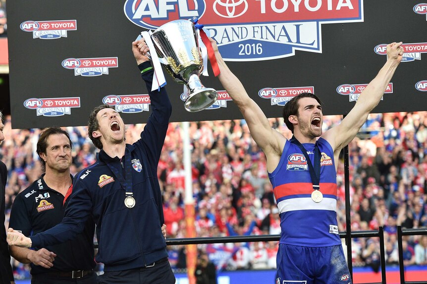 Western Bulldogs' Bob Murphy and Easton Wood hold the AFL premiership cup