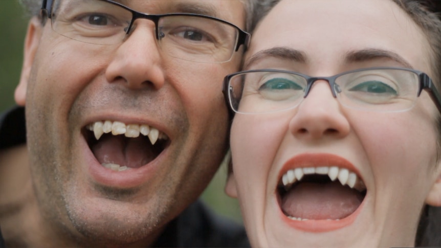 Jarrad and Megan Smith wear their prosthetic fangs