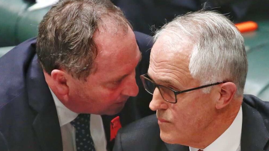 Malcolm Turnbull consults with Barnaby Joyce in parliament