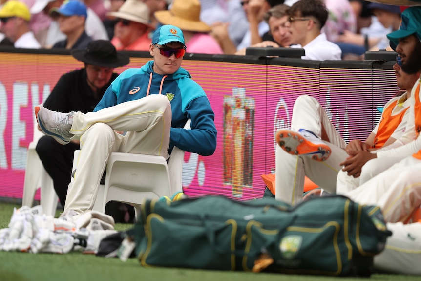 Matt Renshaw sits on his own wearing sunglasses