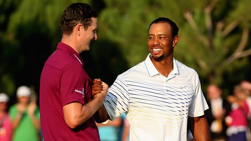 Through to the final ... Justin Rose is congratulated by Tiger Woods.