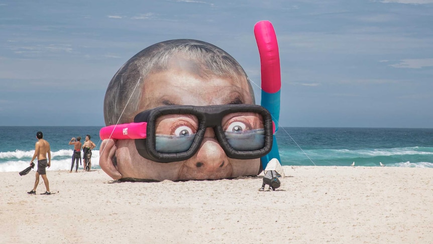 Sculpture “Damien Hirst Looking for Sharks” features the snorkelling head of UK artist Damien Hirst.