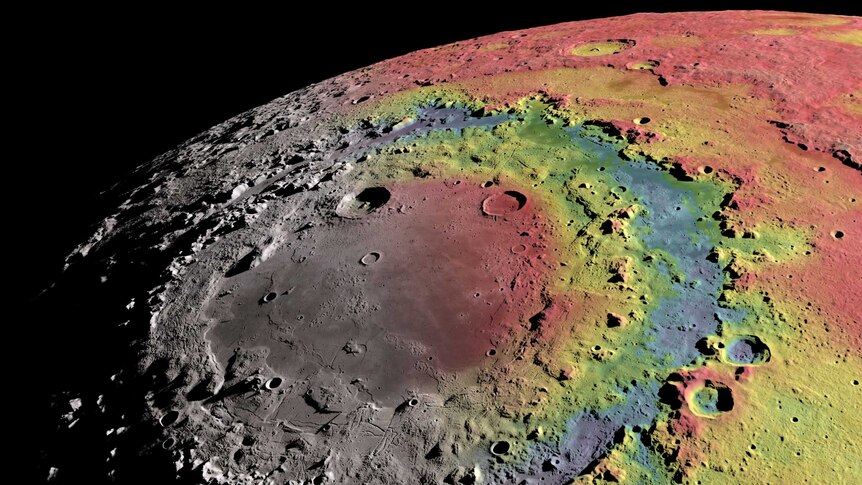 A crater on the moon's rocky, textured surface