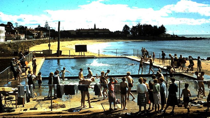 People milling about the Burnie beach pool.
