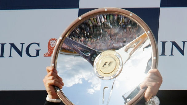 Prized silverware ... Lewis Hamilton celebrates his fifth F1 win.