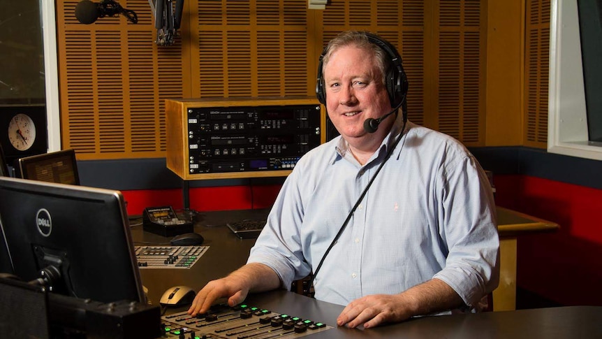 Quinn with headset in studio.