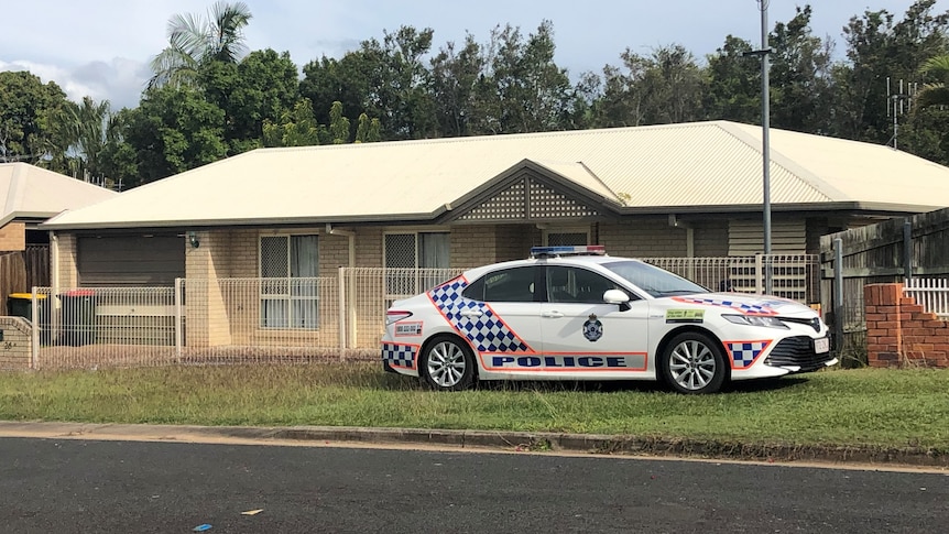 A police car at a house in Maryborough where a fatal dog attack occurred.