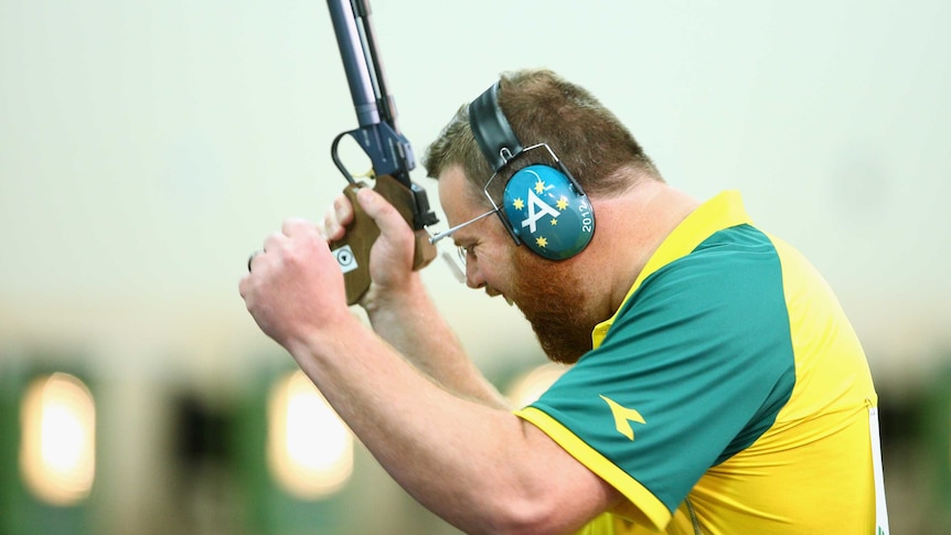 Newcastle's Daniel Repacholi celebrates winning the gold medal in the men's 10m air pistol shooting