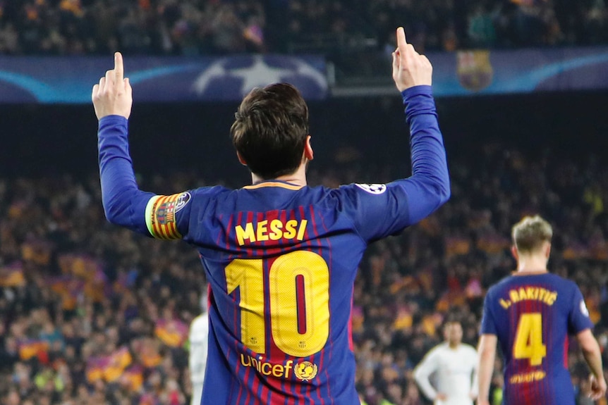 Lionel Messi celebrates after scoring Barcelona's third goal against Chelsea in the Champions League